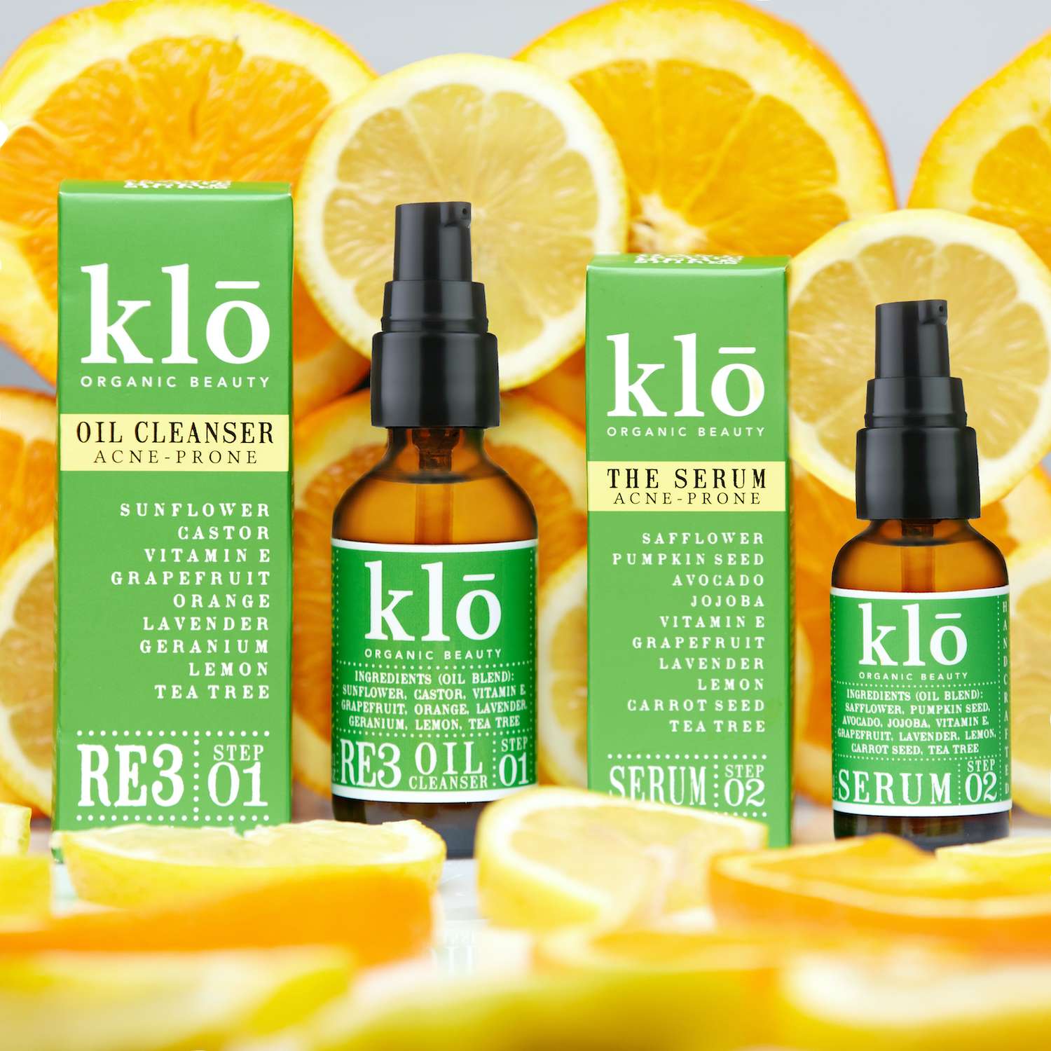 Klo Organic Beauty RE3 oil cleanser and serum for acne-prone skin duo with cut up citrus.